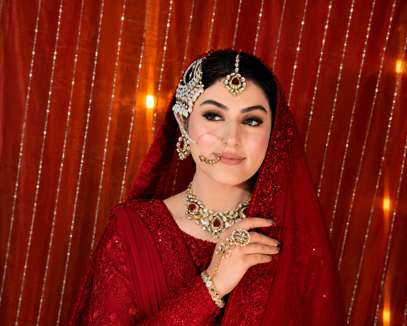 Signature red bridal makeup and jewellery styling by Saba Javed at Makeup Wonders, Lahore